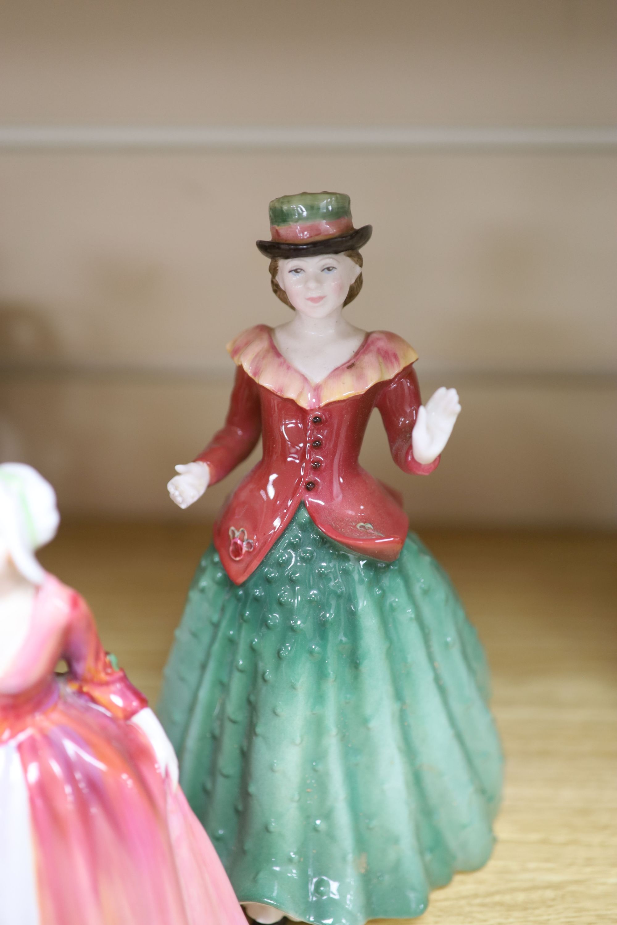 Five Royal Doulton porcelain ladies, two Coalport, one Worcester, another porcelain lady and a Staffordshire figure